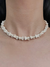 MUKTANK×DARK DREAM Wasteland-style beaded necklace with a bone-shaped design, featuring a detachable chain and multiple ways of wearing