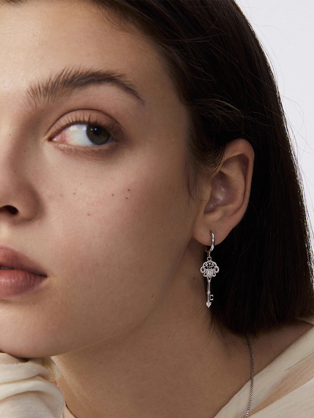 MUKTANK×SUN HUNTERLace key earrings