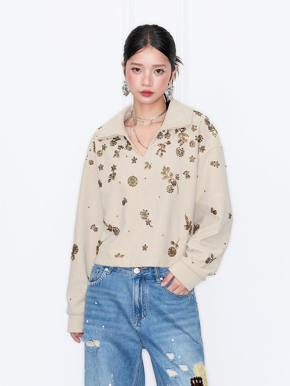 MUKZIN“Capsule Collection”Beige Collared Short Cropped Sweatshirt with Gold Sequin Floral Print